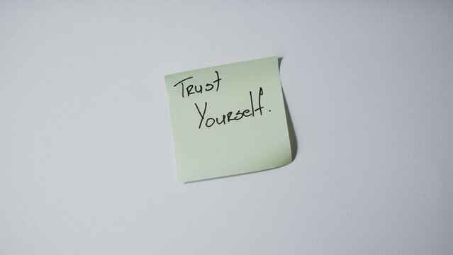 Trust yourself handwritten note on sticky paper minimal concept
