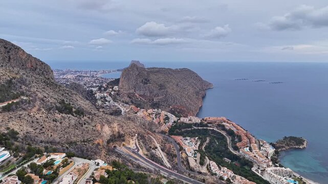 Aerial Winding Highway Along Cliffs And Ocean, Scenic Driver Perspective Showing Switchback Roads, Villas