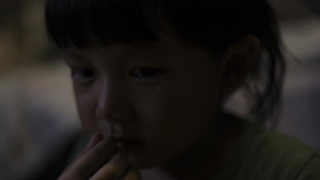 Toddler Cries With Runny Nose, A professional documentary clip of toddler sobbing with snot, small hands wiping face, ideal for parenting reality film or raw feeling documentary.