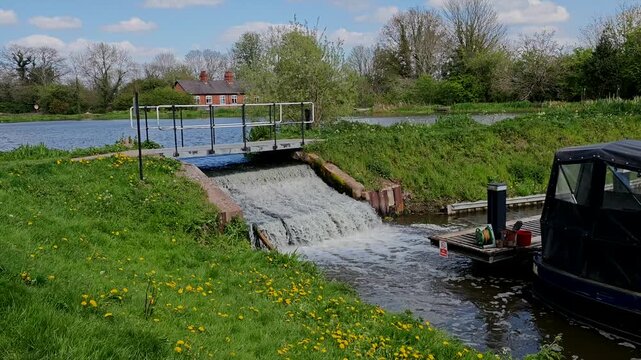 Water flowing into Kingswood Junction canal Marina from reservoir Warwickshire England UK