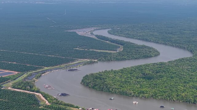 Aerial drone view of Kuala Gula river bend and coastal village