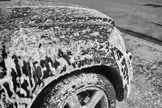 car body covered with wash foam