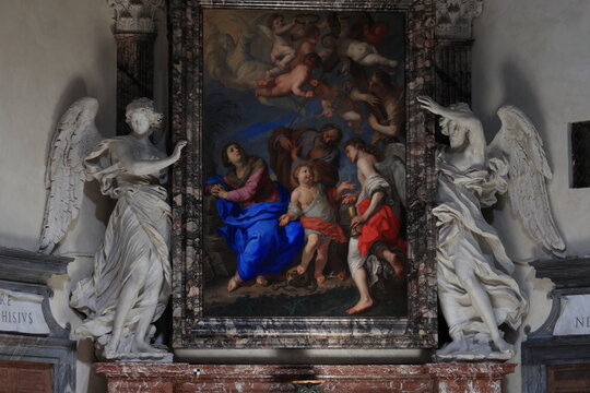 Sculpted Angels Holding a Painting Depicting the Holy Family at the Santa Maria del Popolo Basilica in Rome, Italy