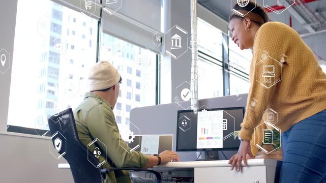 Designer viewing monitor, woman leaning, hex icons highlighting chart, confirming data, thumbs-up
