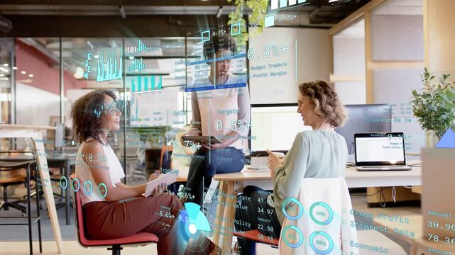 Office team of three lead raising tablet presenting finance graphs for review while overlays moving
