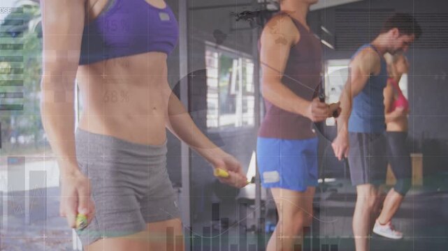 Camera panning up, woman in purple sports bra leading group jumping rope, improving fitness rhythm