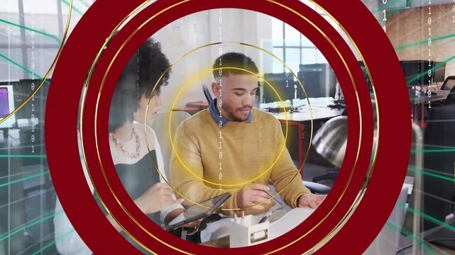 Red rings rotating, thinning, revealing business team reviewing and annotating documents for review