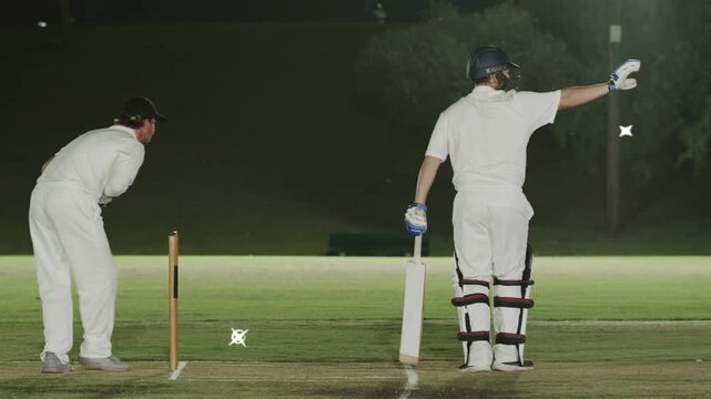 Cricket bowler running releasing ball, batsman defending wicket as turquoise graphics marking ball