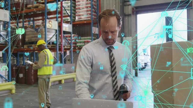 Logistics manager scanning boxes, typing on laptop, updating stock while teal IoT overlaying scene