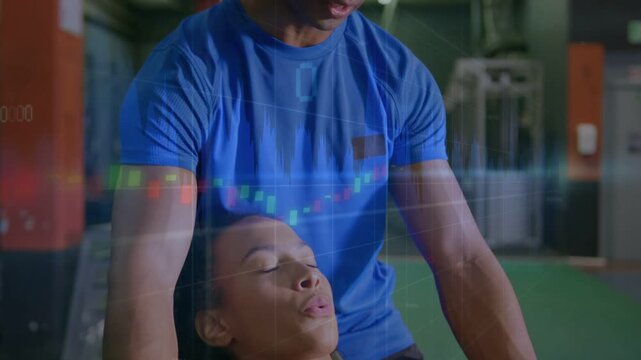 Vertical video: Client pink lying pressing hex dumbbells trainer blue spotting on bench for form