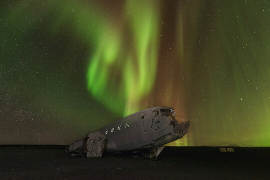 Northern lights over plane wreck in Vik, Iceland