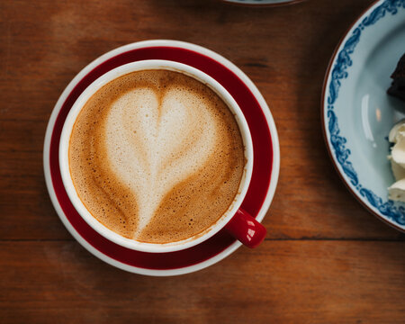 close up of a cafe latte on a table in a cafe