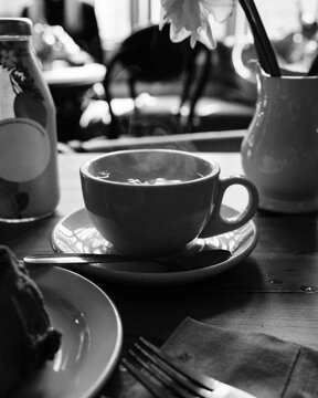 boiling tea in a mug on a table in a cafe in England