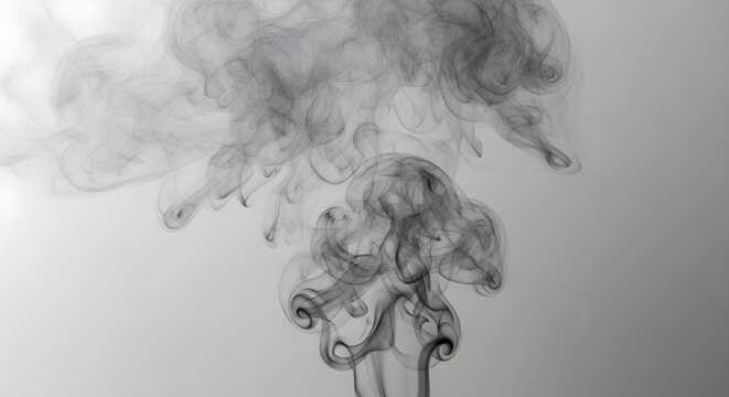 Smoke swirls elegantly forming shapes on a grey background