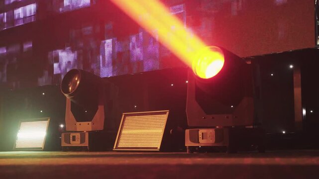 Lighting sets mood. Cinematic lighting and flickering LEDs craft immersive live experiences. Stage crew adjusts fixtures to produce intimate ambiance with dynamic lighting effects and patterns