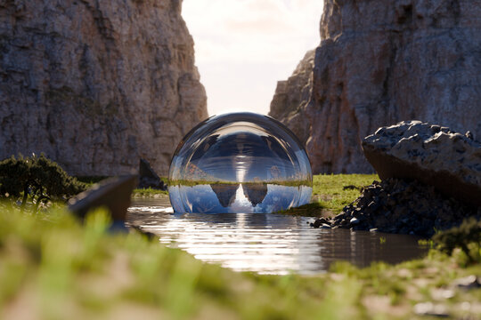 Surreal 3D glass sphere reflecting rocky landscape in water