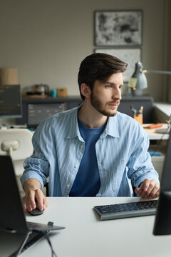 Programmer working at computer in modern office