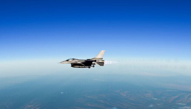 Military fighter jet flying fast high in the blue sky