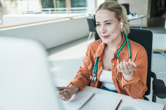 Doctor talking on video call in clinic