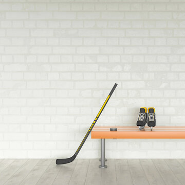 Ice hockey stick and skate on a bench