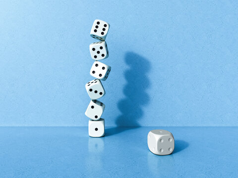 Precarious stack of white dice on a blue background