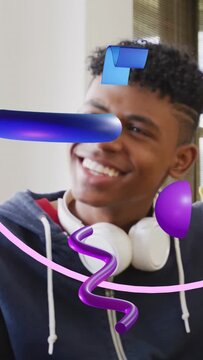 Vertical video: Teenage boy smiling, turning, following drifting 3D ribbons and reacting to AR