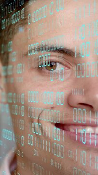 Vertical video: Man gazing as cyan code overlay projecting on pane, scanning left eye for tech scan