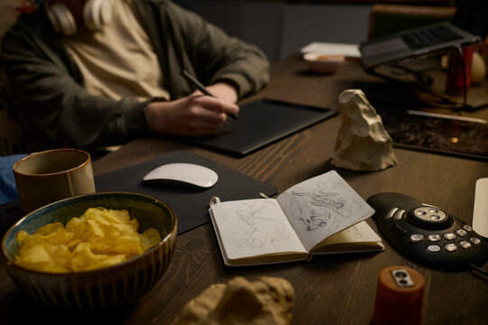 Digital artist drawing on a graphics tablet at indoor workplace