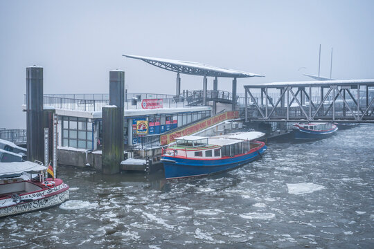 Ferry boat at icy St Pauli harbor in Hamburg during winter