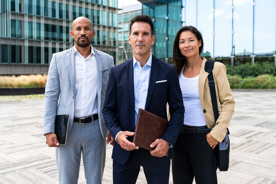Corporate business team standing outdoors in the financial district