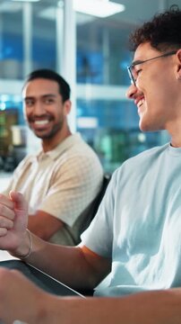 Business, men and celebrate in office for coding goal, app launch or fist pump for success with tech. Smile, team and programmer with computer for positive feedback, sprint completion or target