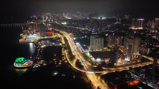 Drone footage shows Lin Xiang Xiong Art Gallery and surrounding waterfront roads and buildings at night.