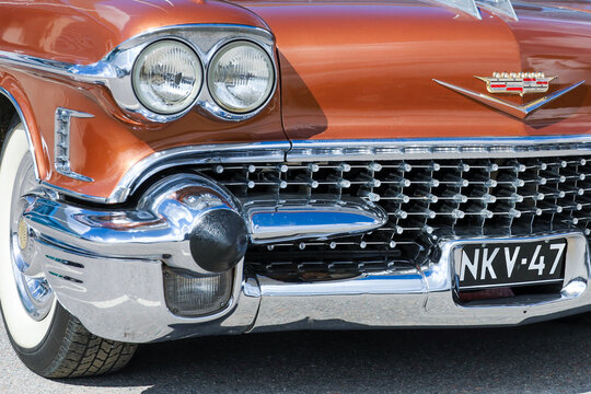 The front end of a copper-colored 1958 American vintage Cadillac at the Classic Motor Show in Lahti, Finland, May 6, 2023