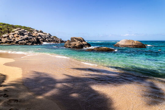 People at Cabo beach in Tayrona National Natural Park, Colombia