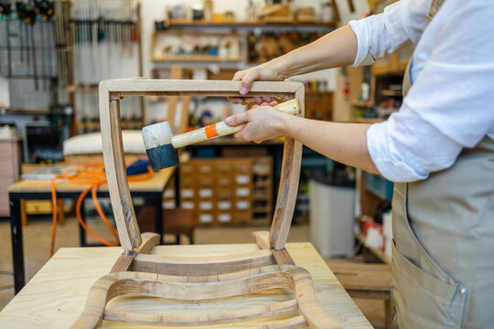 Assembling Wooden Chair Frame with Mallet
