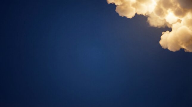 Golden sunset clouds against a deep blue sky with empty space for text (1)