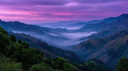 Fototapeta premium Serene Mountain Landscape at Dusk with Mist Rising and a Vibrant Purple Sky over Rolling Hills