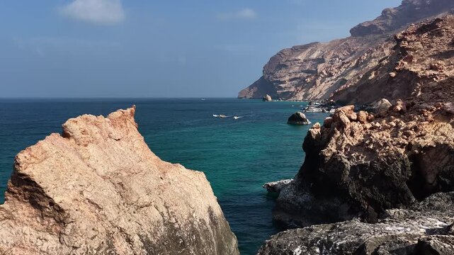 Aerial view flying over rocky coastline and turquoise sea, socotra island