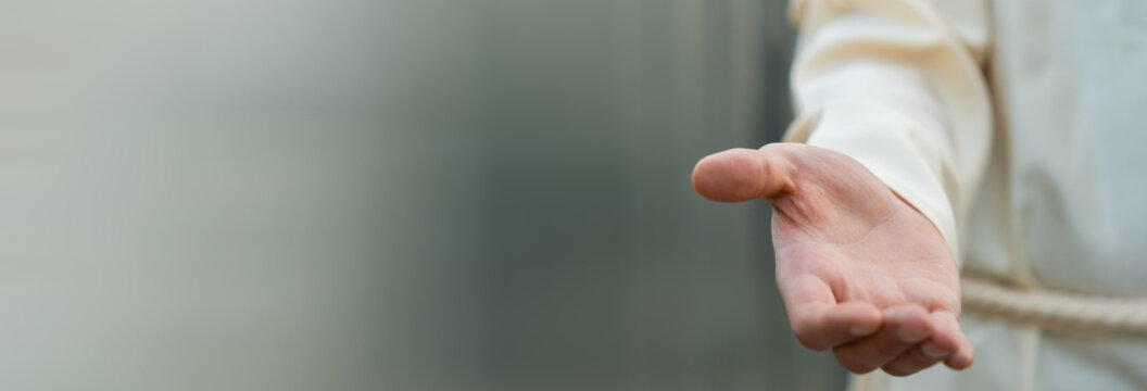 Outstretched hand symbolizing readiness to help, support, or offer assistance, conveying empathy, care, and human connection in a compassionate gesture.