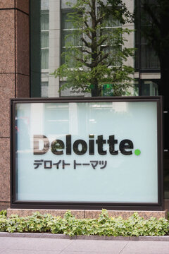 TOKYO, JAPAN - April 22, 2026: Deloitte sign outside an office building, Marunouchi Nijubashi Building, in central Tokyo.