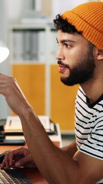 Reading, typing or man in agency for planning, narrative draft or creative writing for character dialogue. Review, tech or script writer with scene revision for plot development, smile or editing
