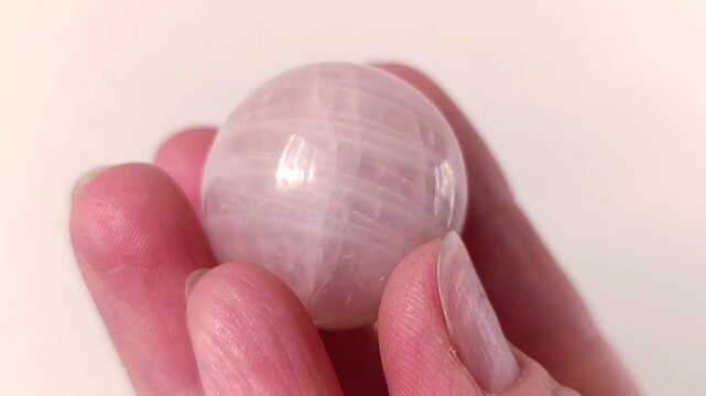 Natural rose quartz mineral in hand. Semi-precious multi-colored stones, minerals close-up. Mineralogy. Collection of minerals.