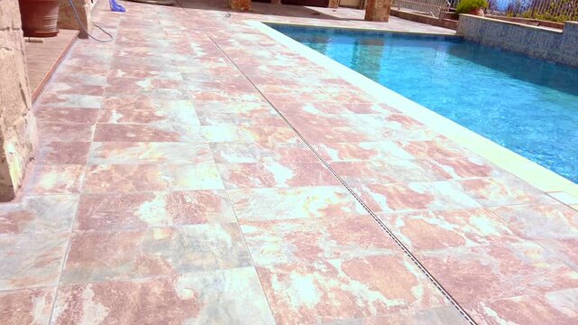 Video clip of pool and ground tiles after the fire repairs the the house and garden.