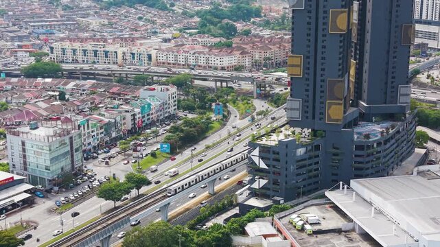 Aerial view of Cheras MRT line and urban district in Kuala Lumpur, showing transport infrastructure, traffic flow, and modern city development in Southeast Asia. UHD.