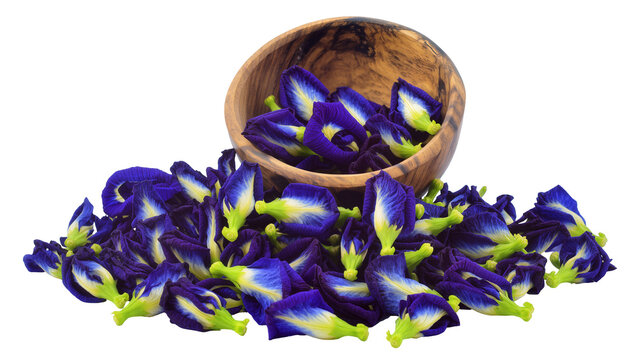 Dried Butterfly Pea Flowers in Wooden Bowl with Scattered Petals