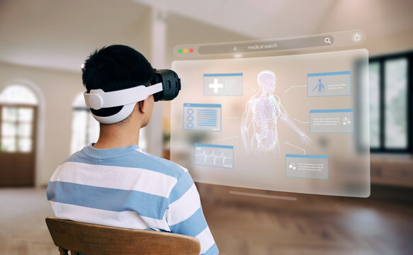 Person using VR headset to explore interactive medical anatomy interface.
