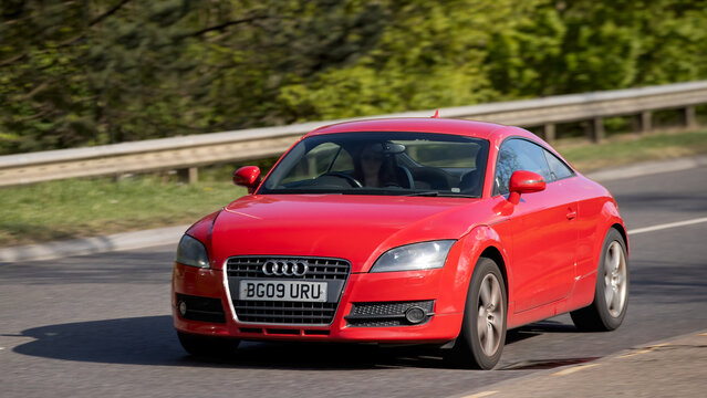 Milton Keynes,Bucks,UK - Apr 21st 2026: 2009 red Audi tt car driving on a British road