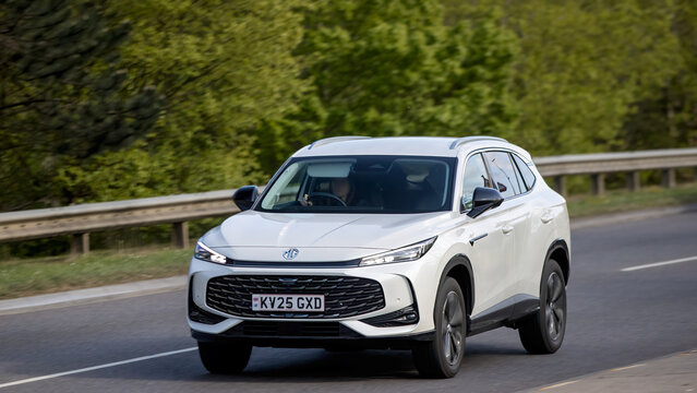 Milton Keynes,Bucks,UK - Apr 21st 2026: 2025 white MG hs trophy SUV car driving on a British road