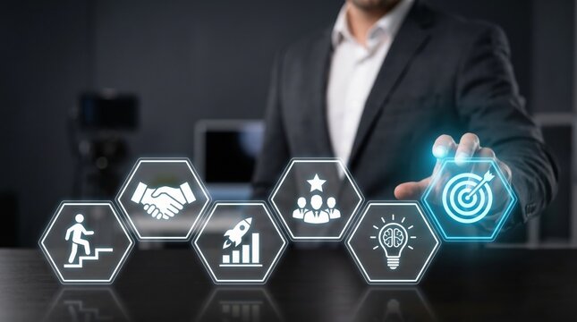 Professional businessman touching a glowing digital interface with business strategy icons like target goal and partnership in a dark modern office environment setting