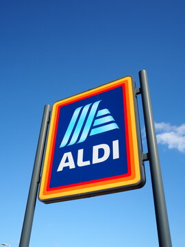 Aldi store sign against a blue sign with logo clear 